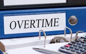 Overtime - blue binder in the office