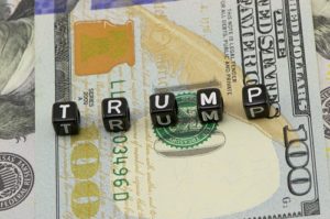 Trump word on dollars background