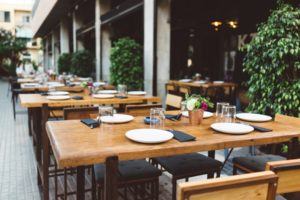 Dish on the wooden table in outdoor restaurant